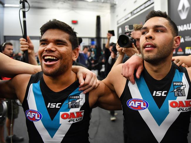 ADELAIDE, AUSTRALIA - AUGUST 13: (L-R) Jake Neade and Jarman Impey of the Power sing the club song after defeating the Magpies during the round 21 AFL match between Port Adelaide Power and the Collingwood Magpies at Adelaide Oval on August 13, 2017 in Adelaide, Australia.  (Photo by Daniel Kalisz/Getty Images)