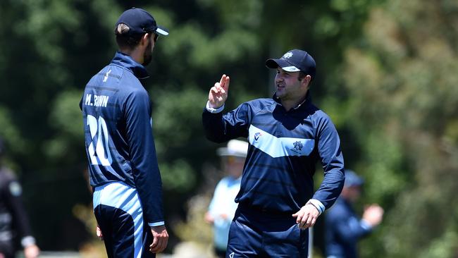 Kew captain-coach Chris Weeks (right) talks to Matt Brown. Picture: Steve Tanner