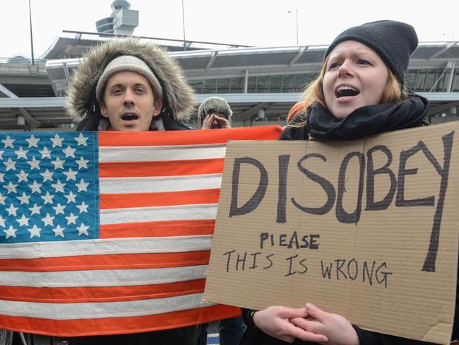 Protesters rally during a protest against the Muslim immigration ban at John F. Kennedy International Airport. Picture: Getty