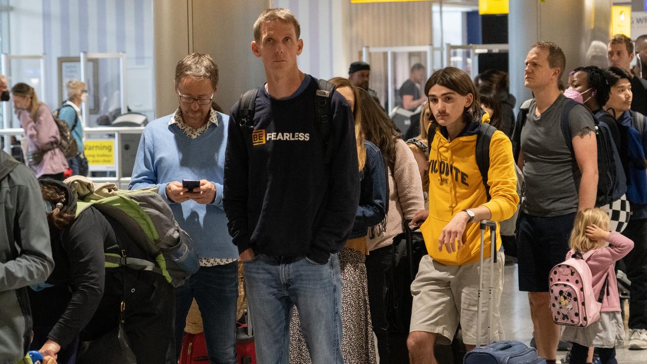 Travellers wait in a long queue to pass through the security check at Heathrow. Picture: Carl Court/Getty Images