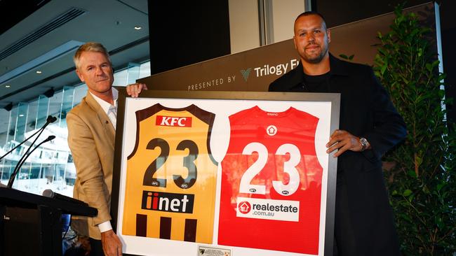 MELBOURNE, AUSTRALIA - APRIL 28: Lance Franklin is presented with a gift by Hawks President Andrew Gowers during the 2024 AFL Round 07 match between the Hawthorn Hawks and the Sydney Swans at the Melbourne Cricket Ground on April 28, 2024 in Melbourne, Australia. (Photo by Michael Willson/AFL Photos via Getty Images)