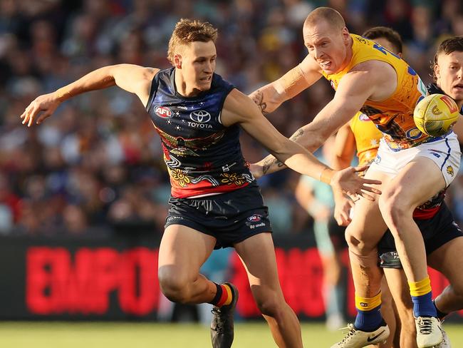 ADELAIDE, AUSTRALIA - MAY 26: Jordan Dawson of the Crows is tackled by Bailey J. Williams of the Eagles during the 2024 AFL Round 11 match between Kuwarna (Adelaide Crows) and Waalitj Marawar (West Coast Eagles) at Adelaide Oval on May 26, 2024 in Adelaide, Australia. (Photo by James Elsby/AFL Photos via Getty Images)