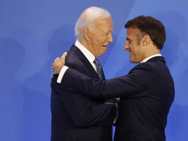French President Emmanuel Macron warmly embraces US President Joe Biden as they attend the summit. Picture: AFP