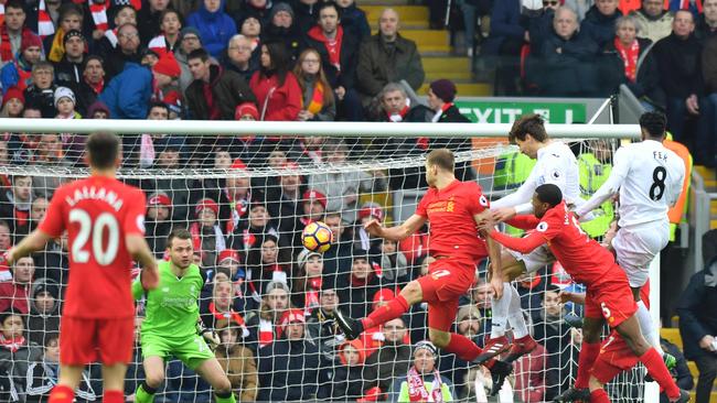 Swansea City's Spanish striker Fernando Llorente (3R) rises high to head the ball.