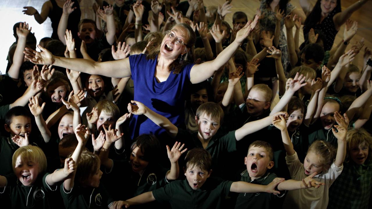 <b>Psalm 98:  Make a joyful noise unto the Lord, all the earth: make a loud noise, and rejoice, and sing praise. </b> <br/>Music teacher Susan West sings with kindergarten and Year 2 pupils and teachers at Charnwood Dunlop School in Canberra, Australian Capital Territory. Photo by Ray Strange