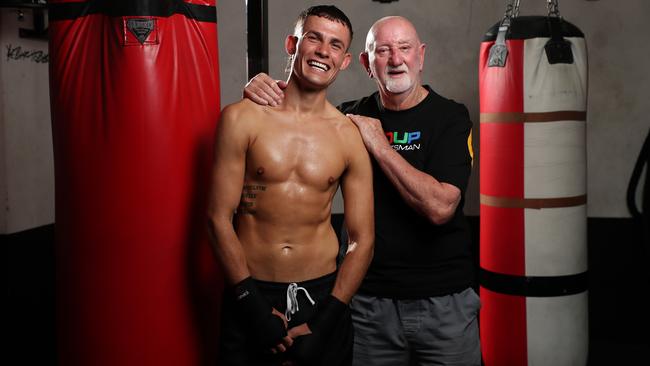 Olympic bronze medallist Harry Garside with trainer Lewis. Picture: No Limit Boxing