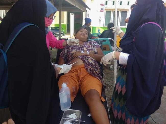 Medical personnel giving medical care to a patient following an earthquake in Donggala, Central Sulawesi. Picture: AFP