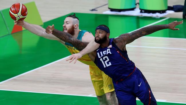 Aron Baynes keeps the ball off DeMarcus Cousins. Picture: Adam Head