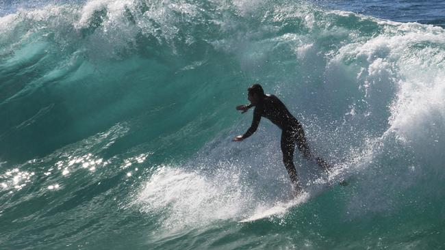 Surfers make the most of an easterly swell on the southern Gold Coast points at Currumbin Alley.