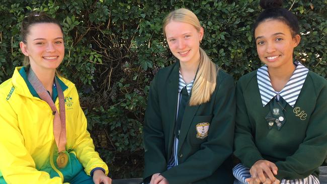 Commonwealth Games gold medallist Skye Nicolson at her old school in Annerley with Our Lady's College students Erin Horan and Ruby Tenorio.