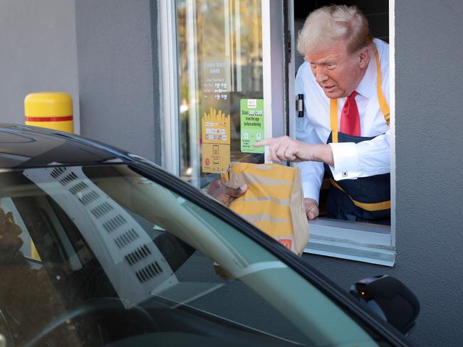 Do you want sauce with that? Donald Trump works the drive-through line as he visits a McDonald's restaurant in Feasterville-Trevose, Pennsylvania. Picture: Getty Images via AFP