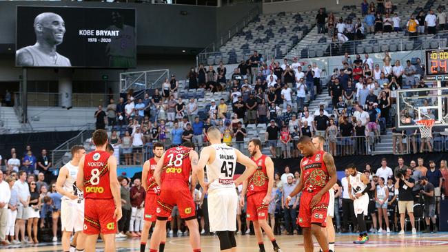 Players pay tribute to Kobe Bryant before the match at Melbourne Arena. Picture: AAP Image/Hamish Blair