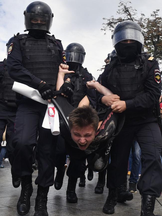 Riot police arrest a protester in Moscow’s Pushkinskaya Square yesterday. Picture: AFP