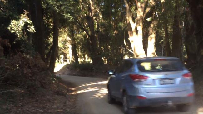 A vehicle drives on the forest track near Benaroon Drive, Kendall.