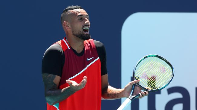 MIAMI GARDENS, FLORIDA - MARCH 29: Nick Kyrgios of Australia reacts after receiving a code violation from the referee in the tiebreak of the first set against Jannik Sinner of Italy during the Miami Open at Hard Rock Stadium on March 29, 2022 in Miami Gardens, Florida.   Michael Reaves/Getty Images/AFP == FOR NEWSPAPERS, INTERNET, TELCOS & TELEVISION USE ONLY ==