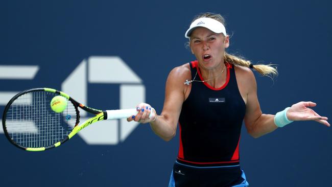 Caroline Wozniacki returns the ball during her women's singles first round match against Samantha Stosur. Picture: Getty Images