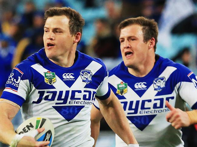 Brett Morris races away to score for the Bulldogs followed by twin brother Josh during the Parramatta Eels v Canterbury Bulldogs NRL round 19 game at ANZ Stadium, Sydney Olympic Park. pic Mark Evans