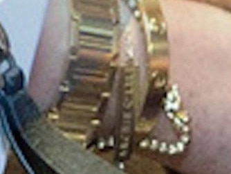 Close up of Meghan Markle's bracelet, which features the names of her children, Archie and Lilibet. Picture: AP