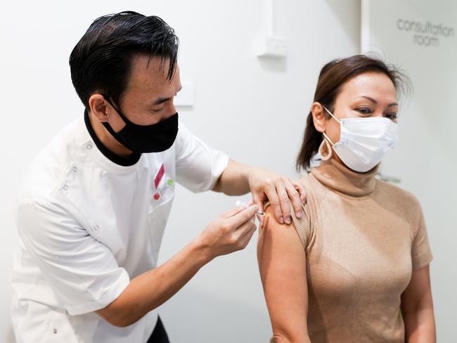 05-08-21 - The spread of Covid misinformation has become the main driver of vaccine hesitancy in SydneyÃs south-west, according to local doctors and community leaders.Pharmacist Quinn On vaccinates Dai Le in Cabramatta . Picture Ryan Osland