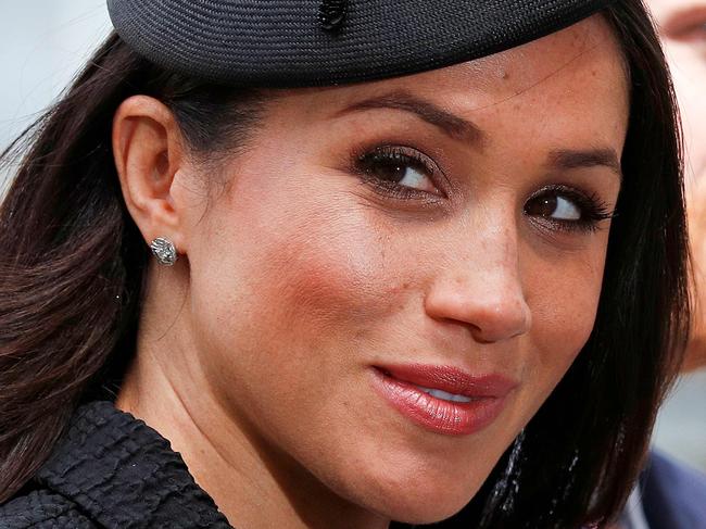 (FILES) In this file photo taken on April 25, 2018 Britain's Prince Harry (R) and his US fiancée Meghan Markle arrive to attend a service of commemoration and thanksgiving to mark Anzac Day in Westminster Abbey in London. Thomas Markle, who has rocked Britain's royal family with a "will he, won't he" drama over his attendance at daughter Meghan's wedding to Prince Harry, is a shy recluse, thrust into the limelight against his wishes. The 73-year-old initially said he was too unwell and embarrassed to walk his daughter down the aisle on Saturday, according to US celebrity news site TMZ, after allegedly staging photos of himself for money and suffering a heart attack amid the ensuing furor.  / AFP PHOTO / Adrian DENNIS