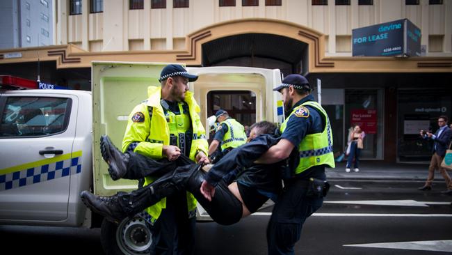 Extinction Rebellion protester arrested in Hobart CBD after Dead Sea March. It's not suggested this person was charged. Picture: Josh Agnew/ Pulse FM Hobart