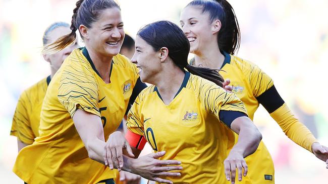 Matildas Sam Kerr (centre) and Laura Alleway celebrate after Kerr scored against Argentina in the Cup of Nations in Melbourne. Picture: Getty Images 