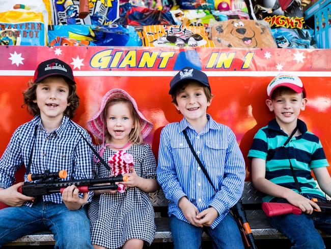 Harry, Pippa and Hugo Hewitt with Will Kenny enjoying the rides and sweet treats of the Clermont Show