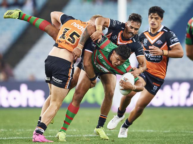 Latrell Mitchell is tackled during the round six NRL match between the South Sydney Rabbitohs and the Wests Tigers on April 17. Picture: Brett Hemmings