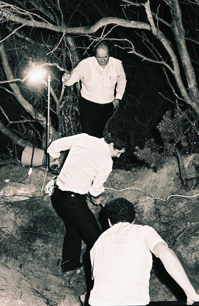 Detectives unearth the bodies of murdered drug couriers Douglas and Isabel Wilson in 1979 from a shallow grave at Rye.