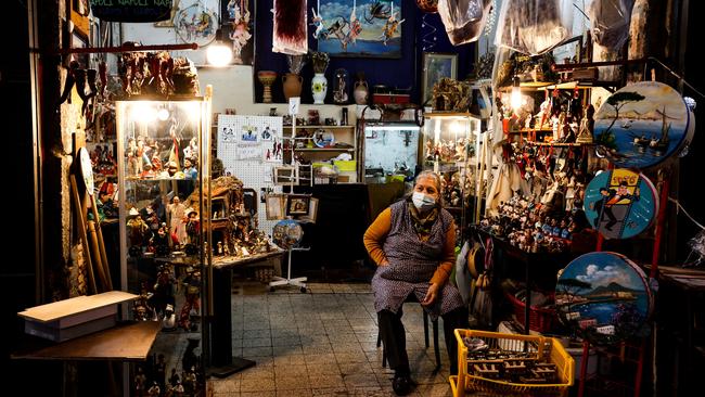 A shop owner waits for customers in San Gregorio Armeno. Picture: IPA