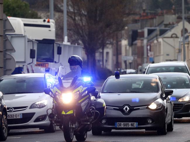 Premier Jay Weatherill’s convoy arrives under police escort at the DCNS shipyard at Cherbourg, France. Photo: Calum Robertson