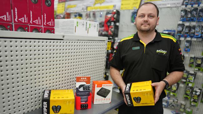 Chris Coombs from Autobarn Cairns holding their stock of engine immobilisers. Picture: Nuno Avendano