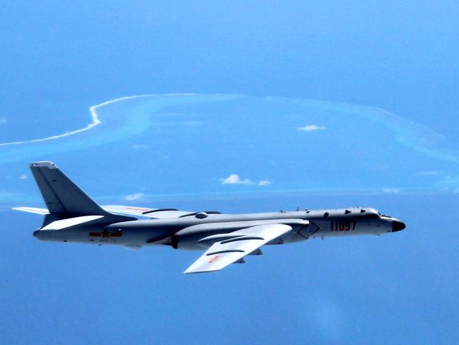 FILE - In this undated file photo released by Xinhua News Agency, a Chinese H-6K bomber patrols the islands and reefs in the South China Sea. An international arbitration panelâ€™s decision on the contested waters of the South China Sea so far is fueling regional tensions rather than tamping them down. In the ensuing 11 days, China has responded to the sweeping victory for the Philippines by flexing its military might. The Philippines faces pressure both at home and abroad not to cede an inch to China after the July 12 decision by a tribunal at The Hague-based Permanent Court of Arbitration. (Liu Rui/Xinhua via AP, File) NO SALES