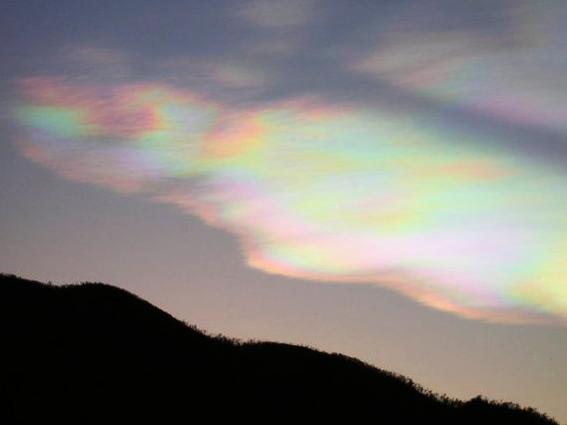 Local resident Susie Cox took this photograph at dusk on Wednesday. Townsville weather forecaster Mario Torrisi said the photo was an example of iridescent cloud, a colour effect caused by the diffraction or bending of the sun's rays by clouds which are both optically thin and made up of similar sized droplets.