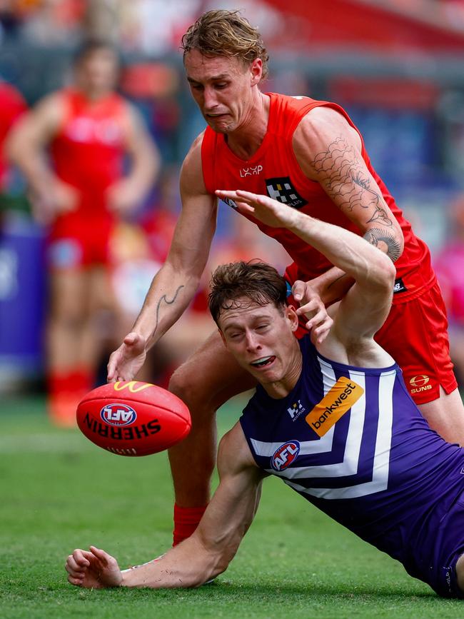 Sam Clohesy and Matt Johnson vie for possession.