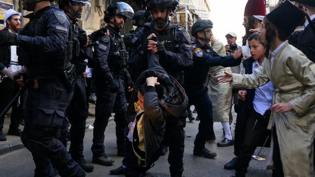 Ultra-Orthodox Jews clash with riot police in Jerusalem. Picture: Getty Images