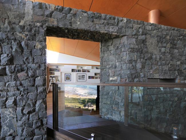 Bluestone is used throughout and the internal bridge above the staircase is a good example of how this material has been used to marry the spaces.