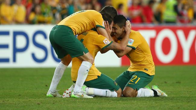 SYDNEY, AUSTRALIA - JANUARY 31: Matt McKay, James Troisi and Massimo Luongo of Australia celebrate victory during the 2015 Asian Cup final match between Korea Republic and the Australian Socceroos at ANZ Stadium on January 31, 2015 in Sydney, Australia. (Photo by Mark Kolbe/Getty Images)