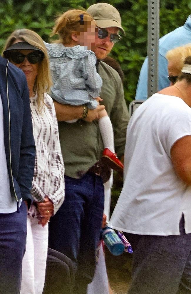 Prince Harry carries daughter Lilibet as they enjoy a father daughter outing on the 4th of July near his home in Montecito. Picture: Backgrid