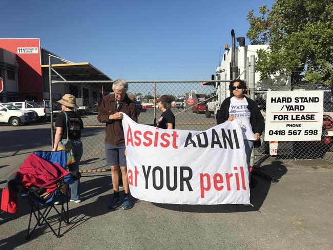 Anti-Adani protesters form a blockade at the Brisbane site owned by Specialised Concrete Pumping.