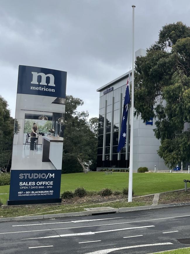 The flag at half mast at Metricon’s Mt Waverley headquarters on Thursday.