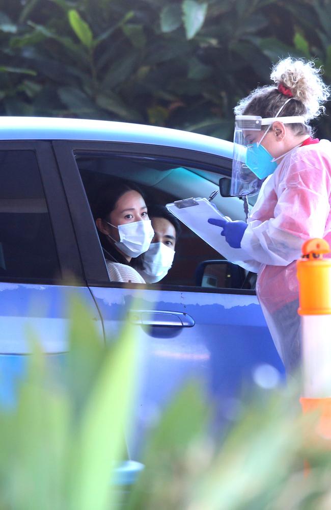 People in cars getting tested at a drive through Covid testing clinic in Bowen Hills earlier this week. Picture: Steve Pohlner