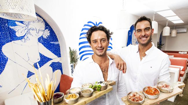 Champion ironman Matt Poole (right) with business partner Oliver Frost (left), with whom he's opened Maman Kitchen &amp; Bar in Burleigh Heads. Picture: NIGEL HALLETT