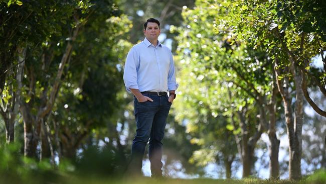 Rio Tinto Chief Decarbonisation Officer Jonathon McCarthy stands among Pongamia trees. The company is developing 3000ha of Pongamia seed farms in North Queensland for a biofuels pilot to explore renewable diesel as a cleaner alternative to fossil fuels. Picture: Supplied.