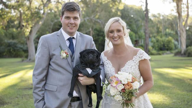 Killer style: Atari the pug in his custom-made Italian suit with groom Matthew Brunes and bride Bridget Williams. Picture: iSpy Wedding Photography (Dylan Evans)