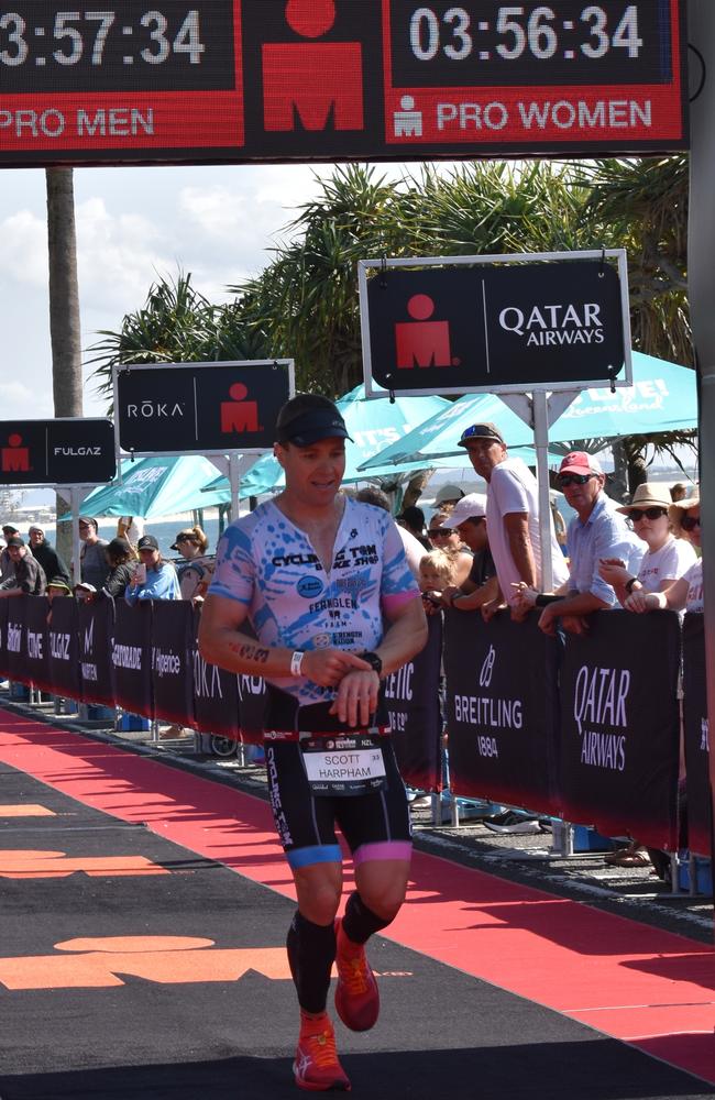 Athletes crossing the finish line at Sunshine Coast Ironman 70.3 2023.