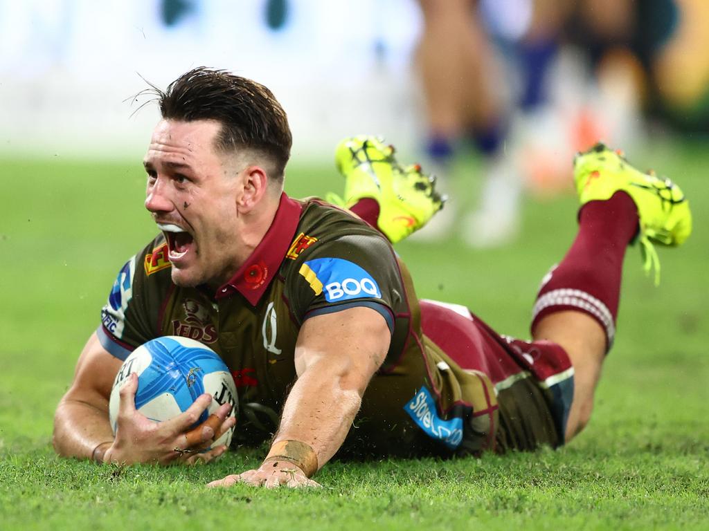 Lachie Anderson scores a try for the Reds. Picture: Getty Images