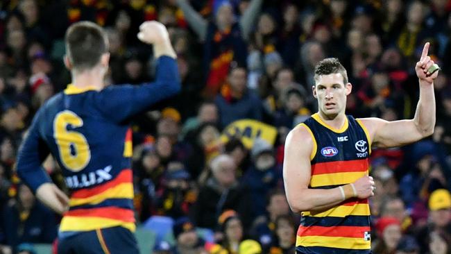 Josh Jenkins celebrates one of his three goals with Bryce Gibbs. Picture: AAP Image/Kelly Barnes