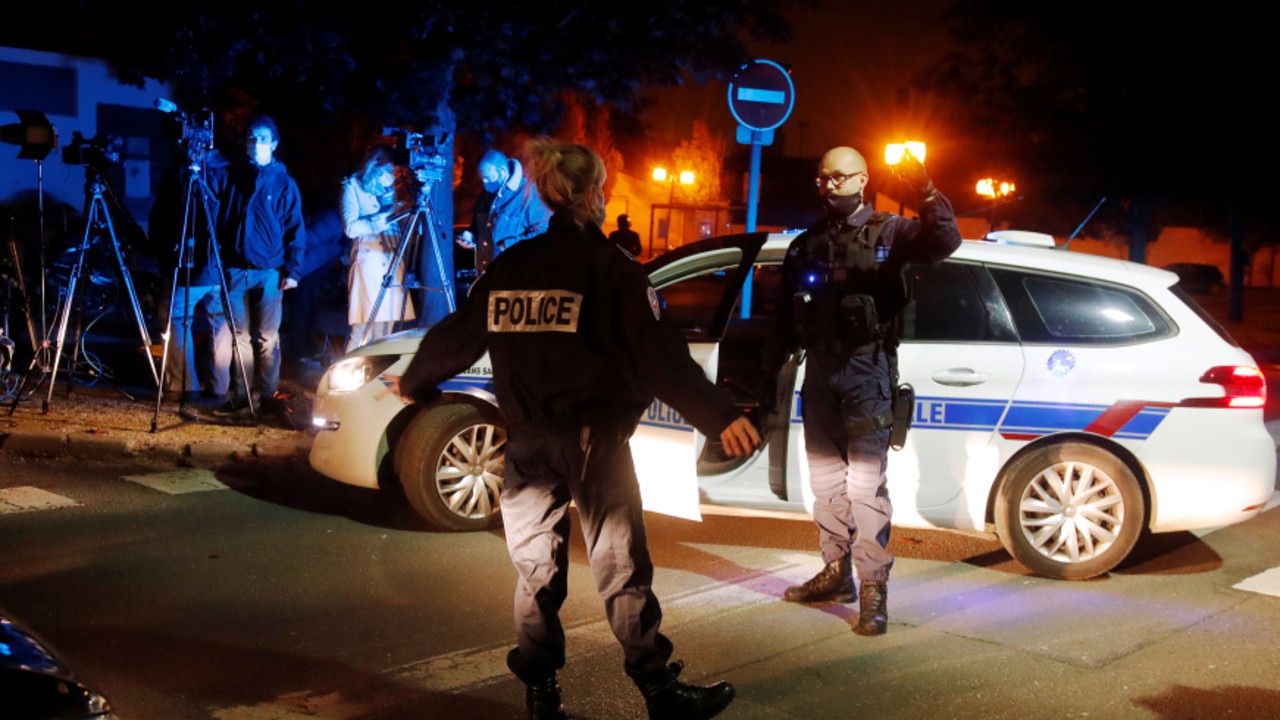 French cops secure the area near the scene in Conflans St Honorine.