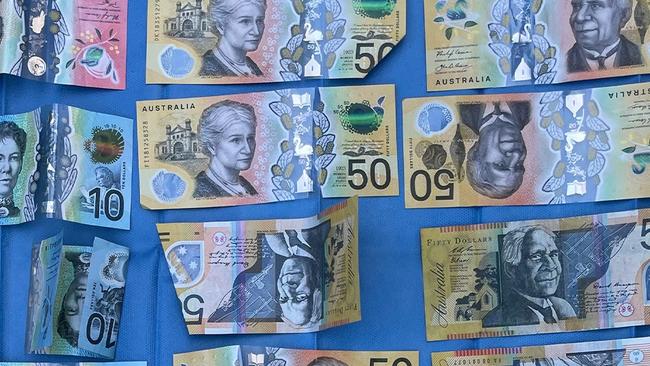 Cash allegedly seized by Raptor Squad during a series of raids across Hunter and mid-north- coast relating to Bandidos. Picture: NSW Police